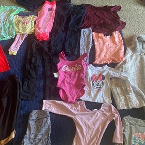 Kids colorful clothes from jeans, leotard, shirts and pajamas fairly used.